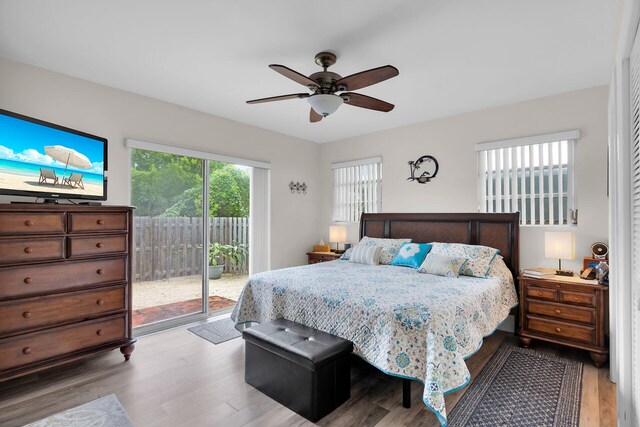 bedroom with ceiling fan, access to exterior, and light hardwood / wood-style flooring