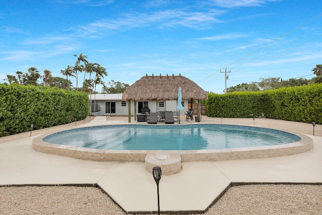 view of swimming pool with a gazebo and a patio