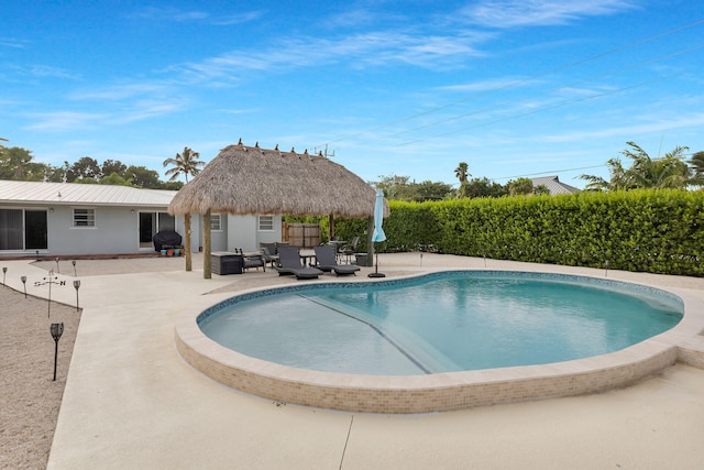 view of pool featuring a gazebo and a patio area