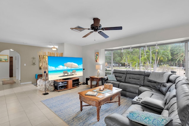 living room with ceiling fan and light tile patterned floors