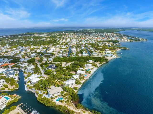 bird's eye view featuring a residential view and a water view