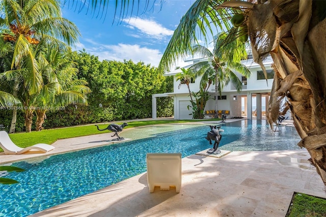 pool featuring a lawn and a patio