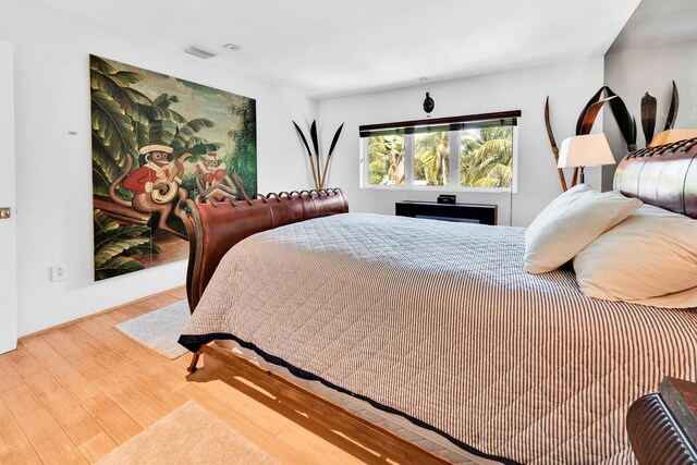 bedroom with wood finished floors