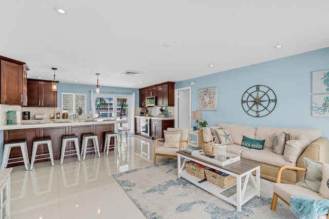 living room featuring light tile patterned floors