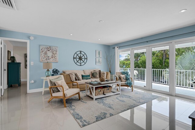 tiled living room featuring french doors