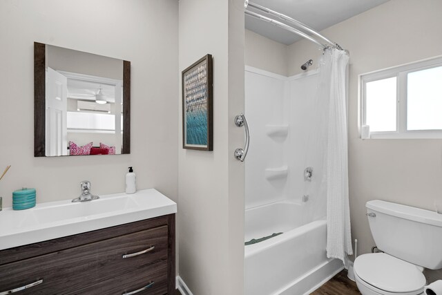 full bathroom featuring hardwood / wood-style flooring, vanity, shower / bathtub combination with curtain, and toilet