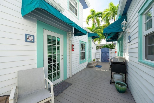 wooden deck featuring area for grilling