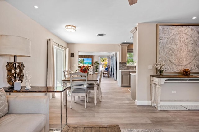 dining space featuring light hardwood / wood-style flooring