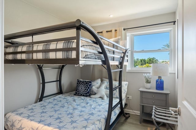 bedroom with wood-type flooring