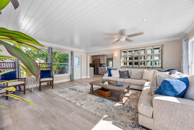 living room featuring ceiling fan, crown molding, light hardwood / wood-style floors, and wooden ceiling