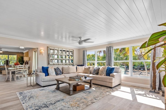 sunroom / solarium featuring ceiling fan