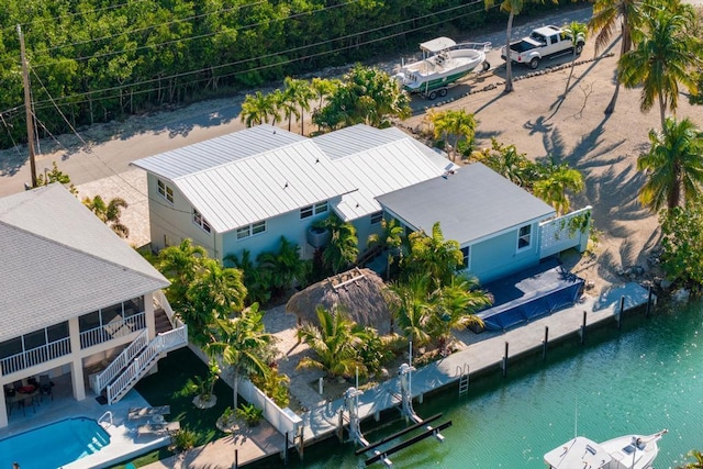 birds eye view of property with a water view