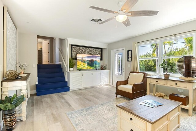 sitting room with ceiling fan and light hardwood / wood-style floors