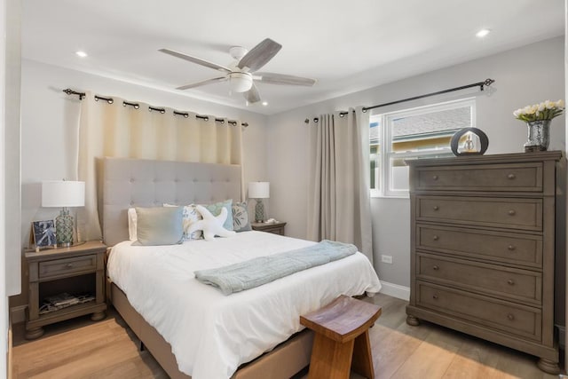 bedroom featuring light hardwood / wood-style flooring and ceiling fan