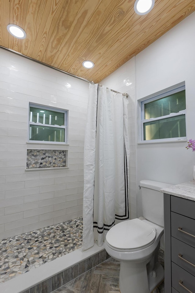 bathroom featuring toilet, wooden ceiling, and a shower with curtain