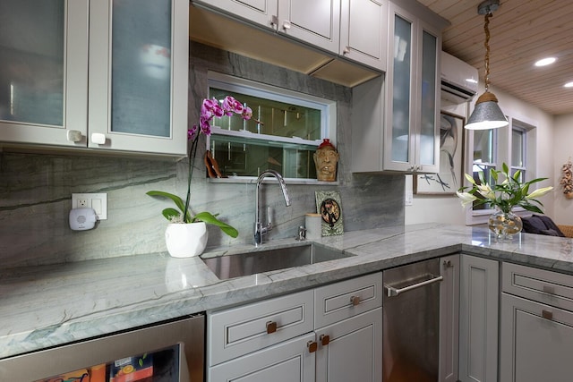 kitchen with sink, decorative light fixtures, beverage cooler, light stone countertops, and backsplash