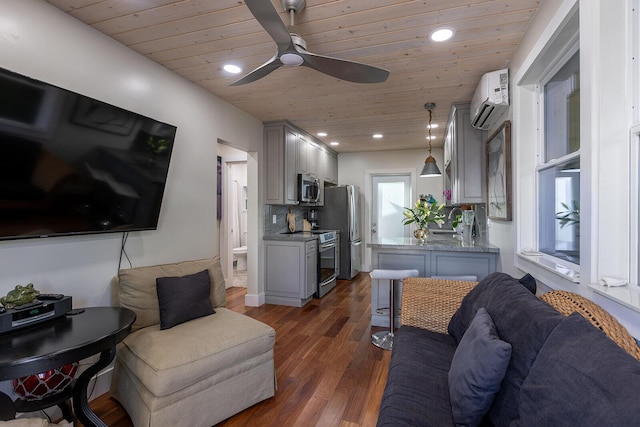 living room featuring ceiling fan, dark hardwood / wood-style floors, a wall mounted AC, and wood ceiling