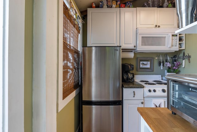 kitchen featuring wood counters, white appliances, and white cabinets