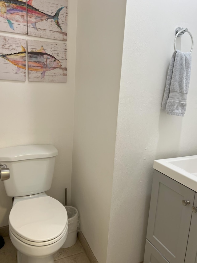 bathroom featuring vanity, toilet, and tile patterned flooring