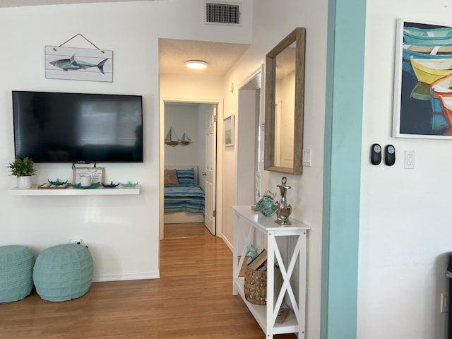 hallway featuring wood-type flooring