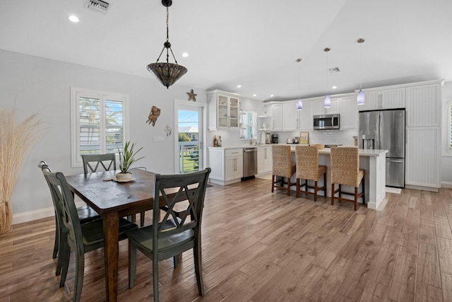 dining space featuring light wood-type flooring