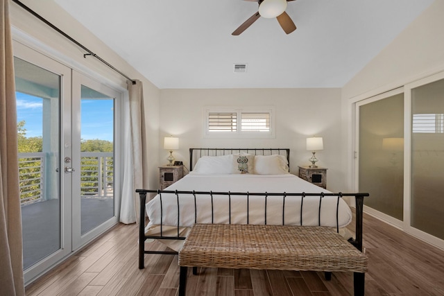 bedroom with hardwood / wood-style flooring, ceiling fan, lofted ceiling, and access to exterior