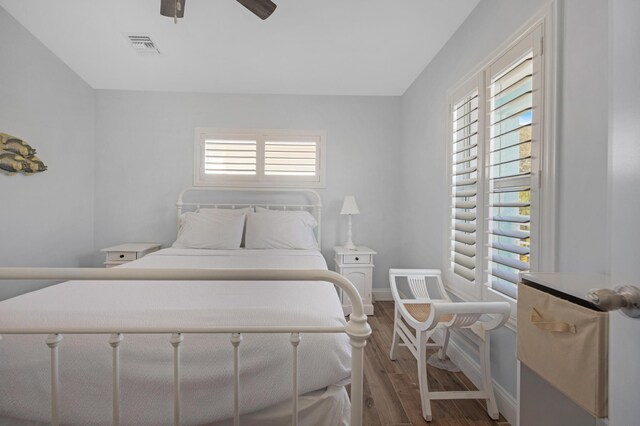 bedroom with wood-type flooring and ceiling fan