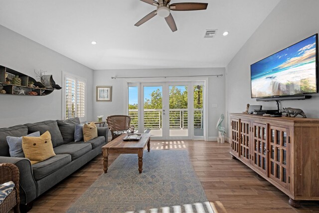 living room featuring french doors, ceiling fan, vaulted ceiling, and hardwood / wood-style floors