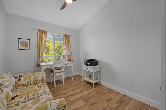 office space featuring lofted ceiling, ceiling fan, and light wood-type flooring