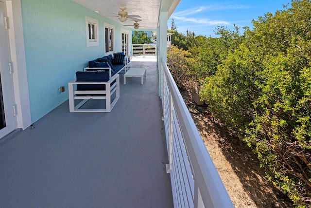 view of patio with a balcony and ceiling fan