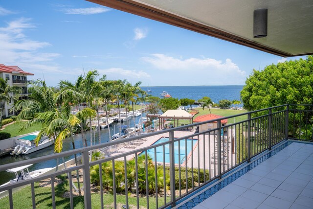 balcony featuring a water view