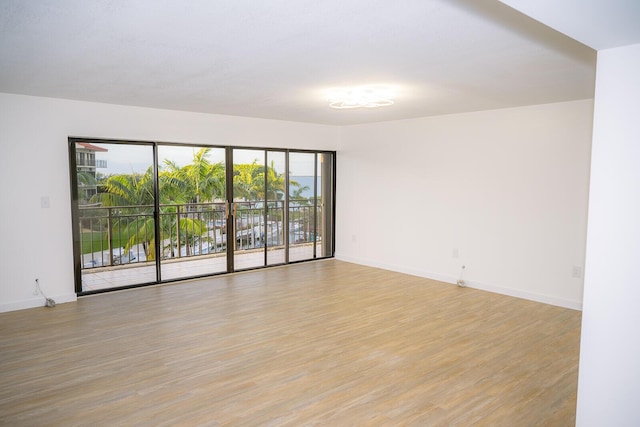 spare room featuring light hardwood / wood-style floors