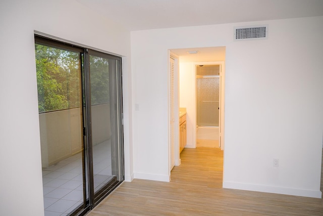 corridor featuring light hardwood / wood-style flooring