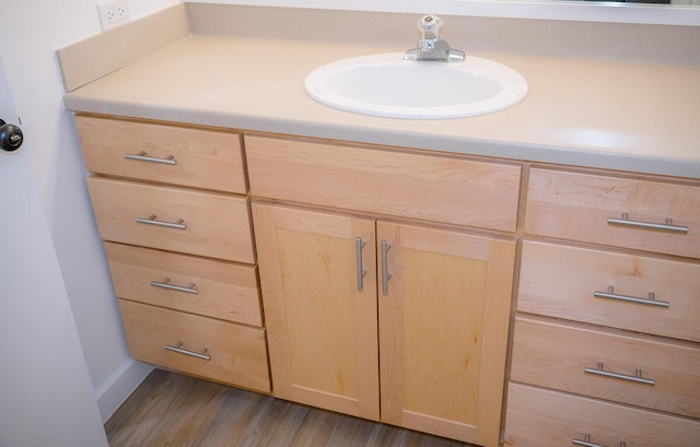 bathroom featuring vanity and hardwood / wood-style floors