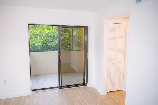 doorway to outside featuring light hardwood / wood-style floors