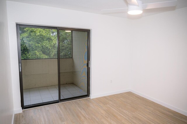 empty room featuring wood-type flooring and ceiling fan