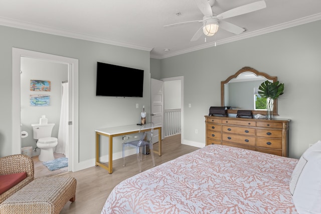 95 Coco Plum Dr Unit 5D, Marathon, FL 33050 - bedroom featuring crown molding, wood finished floors, baseboards, and connected bathroom