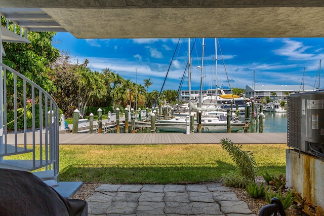 95 Coco Plum Dr Unit 5D, Marathon, FL 33050 - view of home's community with a boat dock, a lawn, and a water view