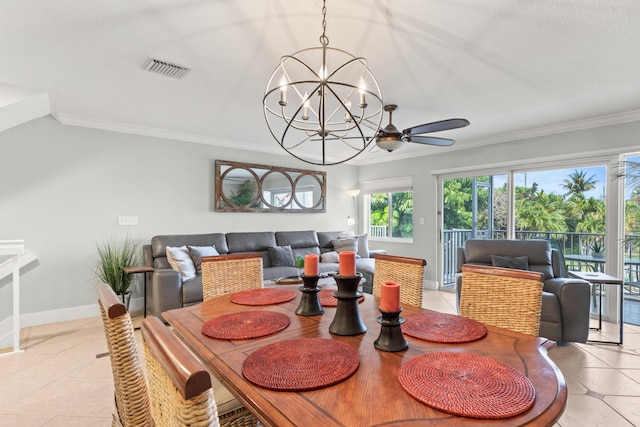 95 Coco Plum Dr Unit 5D, Marathon, FL 33050 - dining room with light tile patterned flooring, a chandelier, crown molding, baseboards, and ceiling fan
