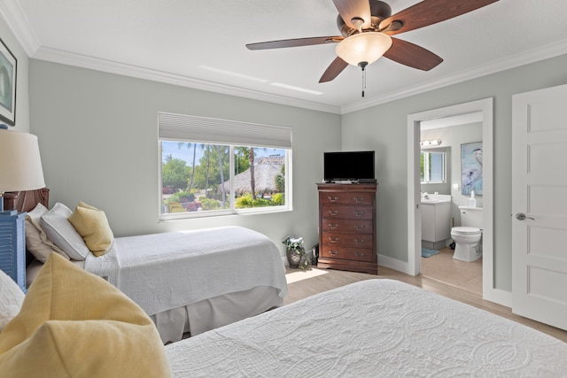 95 Coco Plum Dr Unit 5D, Marathon, FL 33050 - bedroom with ornamental molding, wood finished floors, baseboards, ensuite bathroom, and ceiling fan