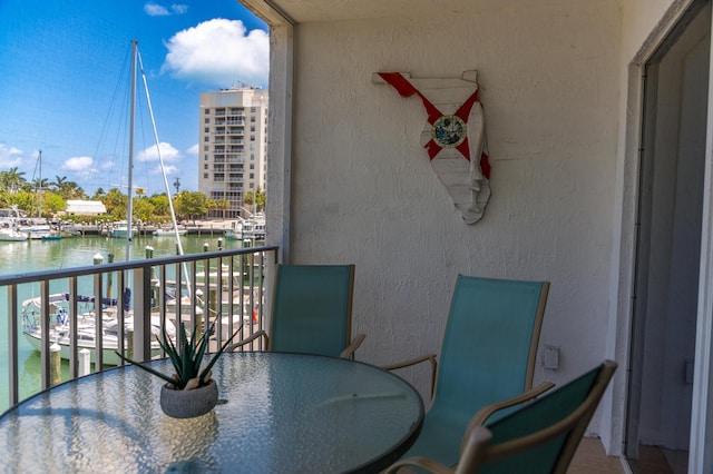 95 Coco Plum Dr Unit 5D, Marathon, FL 33050 - balcony featuring a water view and outdoor dining space