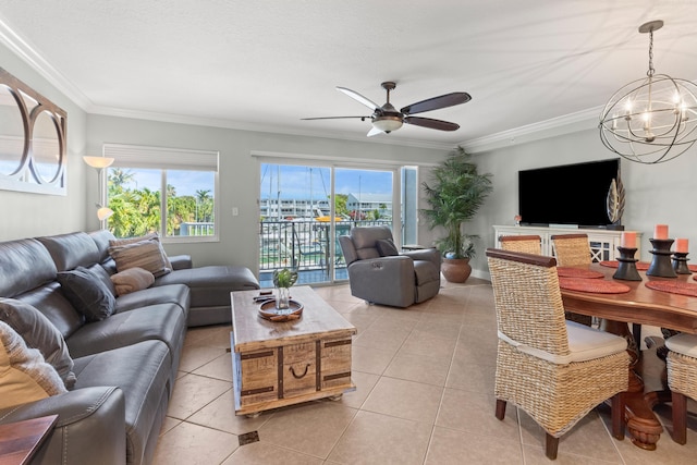 95 Coco Plum Dr Unit 5D, Marathon, FL 33050 - living area with a chandelier, a ceiling fan, ornamental molding, and light tile patterned floors