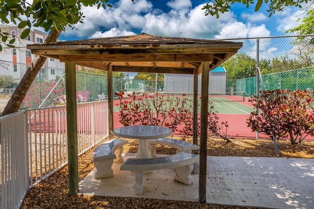 95 Coco Plum Dr Unit 5D, Marathon, FL 33050 - view of patio featuring a tennis court and fence
