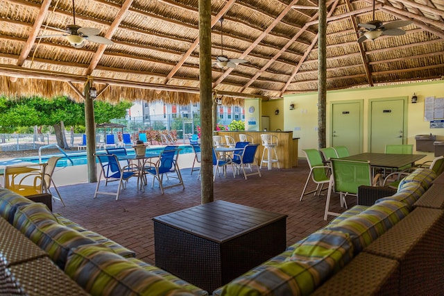 95 Coco Plum Dr Unit 5D, Marathon, FL 33050 - living room with ceiling fan, plenty of natural light, brick flooring, wood ceiling, and vaulted ceiling