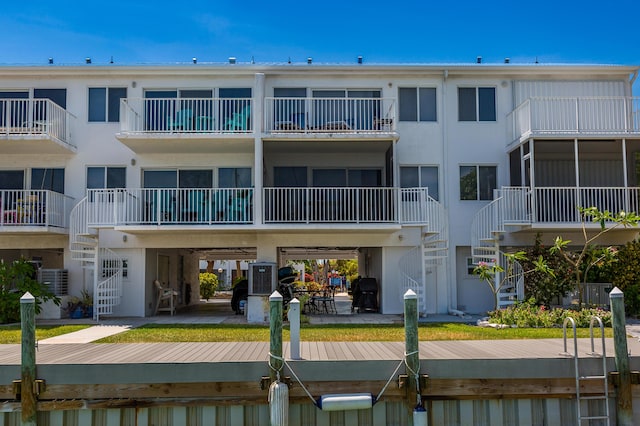 95 Coco Plum Dr Unit 5D, Marathon, FL 33050 - back of property featuring stairway and stucco siding
