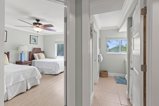 95 Coco Plum Dr Unit 5D, Marathon, FL 33050 - bedroom with crown molding, multiple windows, baseboards, and a ceiling fan