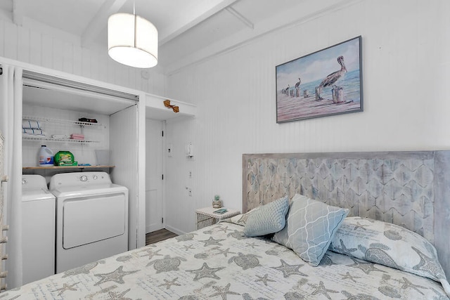 bedroom featuring separate washer and dryer