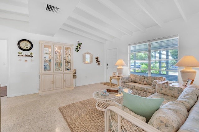 living room with lofted ceiling with beams