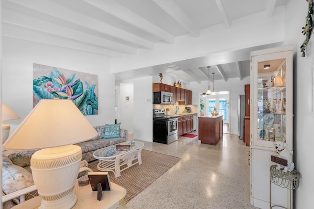 living room featuring sink and vaulted ceiling with beams