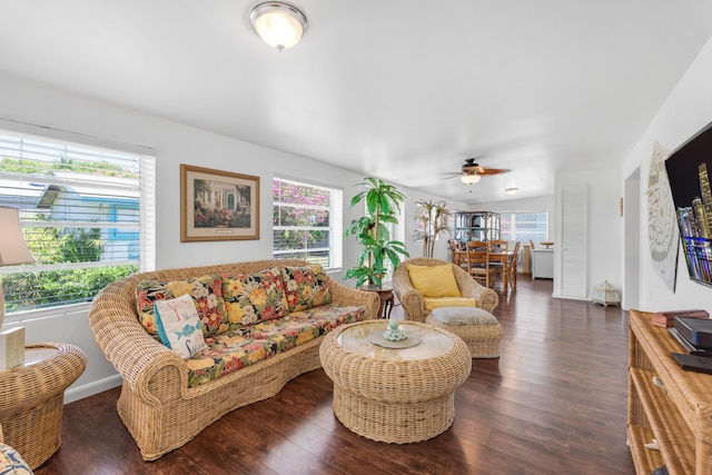 living room with dark hardwood / wood-style floors and ceiling fan